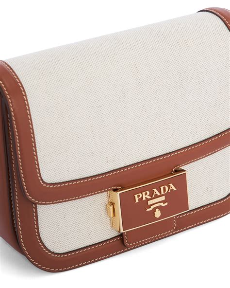 prada emblème bag in linen blend and leather|Prada Emblème Bag in linen blend and leather.